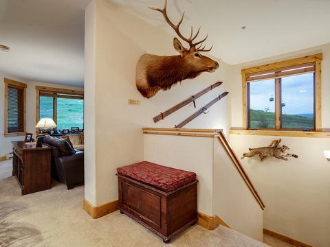 Step into a cozy mountain retreat where rustic charm meets comfort. Warm wood tones, soft seating, and unique decor create a welcoming space to unwind after your alpine adventures.
