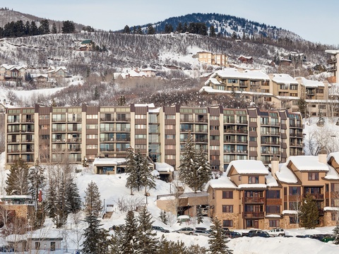 Ski-in ski-out convenience in a picturesque winter village surrounded by snow-covered slopes and mountain peaks.