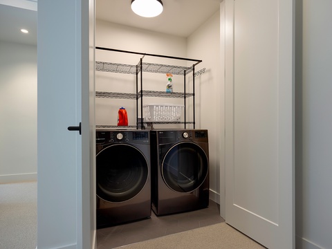 You'll never have to leave your vacation oasis for laundry day—this dedicated space includes a full-size washer and dryer plus handy shelving for all your supplies.