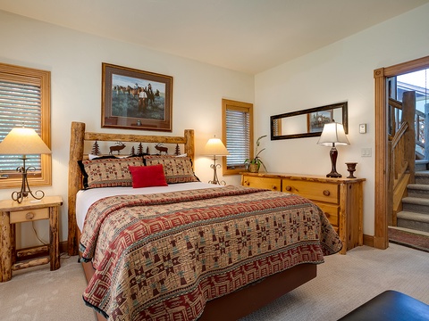 Unwind in your cozy retreat with rustic log furnishings, plush bedding, and charming Western artwork that makes you feel right at home in the mountains.
