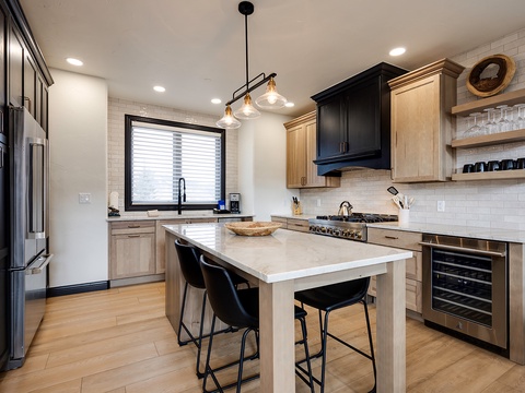 Step into your gourmet kitchen with sleek quartz countertops, premium stainless appliances, and a stylish island where you can gather for meals or cocktails under designer lighting.