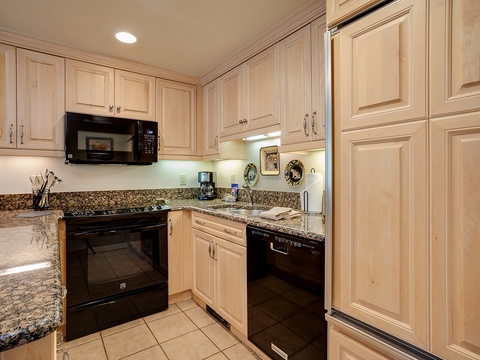 Your fully equipped kitchen invites effortless meal prep with granite counters, modern appliances, and warm wood cabinetry—perfect for brewing morning coffee or preparing a homemade feast.