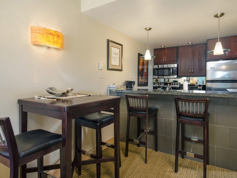 Picture yourself preparing your favorite meal in this fully equipped kitchen, then gathering at the breakfast bar or dining table to enjoy it together.