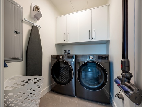 Your dedicated laundry room makes packing light a breeze, with a full-size washer and dryer, plus ample cabinet space for all your supplies.