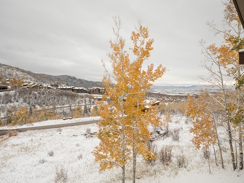 Stunning mountain vistas frame the property, nestled in a valley where autumn gold meets winter's first snow, offering a serene seasonal retreat.
