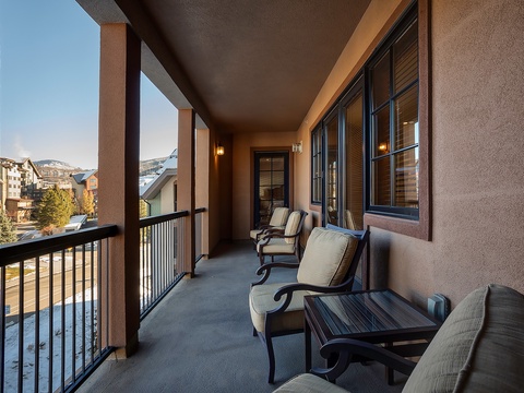 Your private balcony invites you to unwind with plush seating, gentle mountain breezes, and serene neighborhood views that make every morning coffee feel like a retreat.