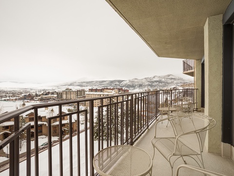 Scenic mountain vistas stretch across the horizon from this spacious private balcony—a perfect spot to sip your morning coffee and plan your day's adventure.