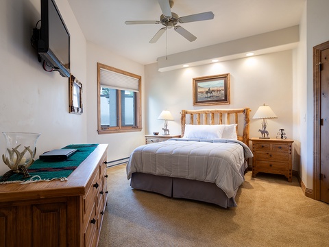 Step into your cozy mountain retreat with rustic log accents and crisp linens waiting to cradle you after a day of adventure. Soft lighting and thoughtful decor create the perfect sanctuary for your getaway.