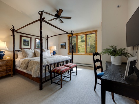 Wake up to mountain scenery framed by your bedroom window, where a handcrafted four-poster bed and thoughtful touches create your peaceful alpine retreat.