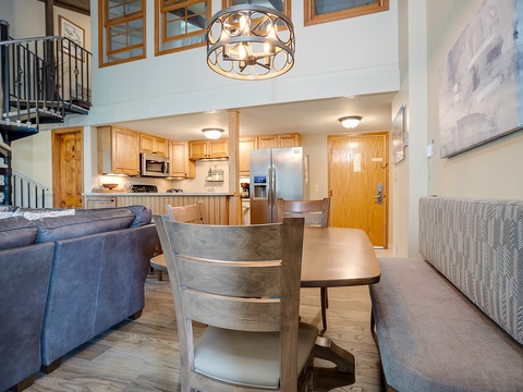 Your spacious loft retreat blends comfort and style with soaring ceilings, a cozy dining space, and a fully equipped kitchen perfect for family meals and mountain getaway memories.