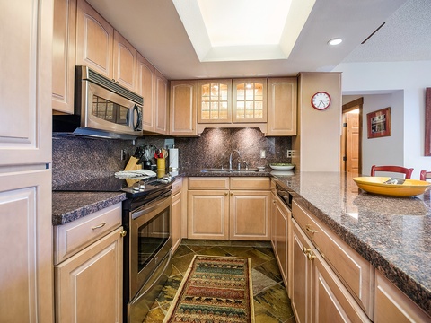 Your fully equipped kitchen features granite countertops, modern appliances, and plenty of prep space—perfect for creating memorable meals during your stay.