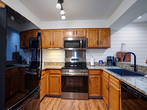Your fully equipped kitchen awaits with stainless steel appliances, granite countertops, and all the essentials for preparing meals just the way you like them.