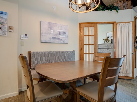 Gather around this inviting dining table where you can share meals and stories with your travel companions. The warm wood tones and elegant lighting create the perfect atmosphere for memorable dinners together.