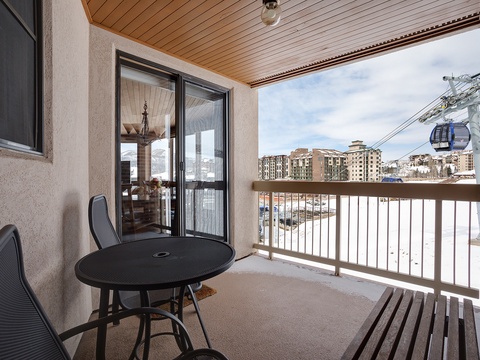 Step onto your private balcony to take in the mountain village views and convenient gondola access. Enjoy morning coffee at the outdoor table, surrounded by fresh alpine air and panoramic scenery that puts adventure at your doorstep.