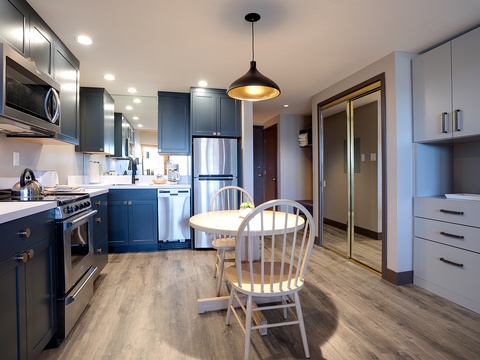 Your fully-equipped kitchen welcomes you with modern appliances, sleek cabinetry, and a cozy dining nook—perfect for preparing home-cooked meals and enjoying morning coffee together.