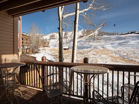 Your private balcony overlooks stunning snow-dusted slopes and mountain scenery. Sip morning coffee at your bistro table and soak in the crisp alpine air and winter views.