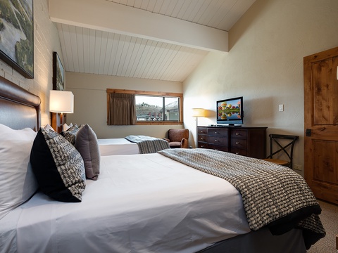 Sink into plush linens and rest easy in your private retreat, where vaulted ceilings and soft lighting create a calming escape after your day's adventures.