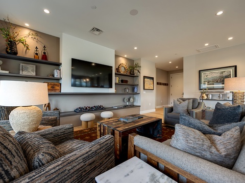 Sink into plush seating and unwind in your stylish living space, where warm woods, soft textures, and thoughtful details create the perfect gathering spot for your group.