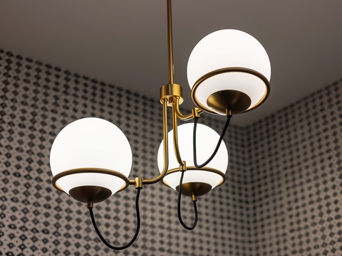 Sophisticated mid-century modern lighting creates ambiance in your space. The brass and globe pendant fixture sets a warm, stylish mood for evening gatherings.
