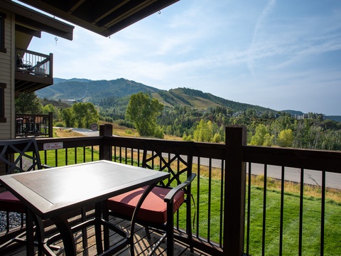 Scenic mountain views frame this inviting balcony, where you can enjoy morning coffee or evening relaxation surrounded by lush forests and rolling alpine terrain.