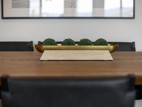 Gather around this handsome dining table where a sculptural centerpiece sets the tone for memorable meals and great conversation.