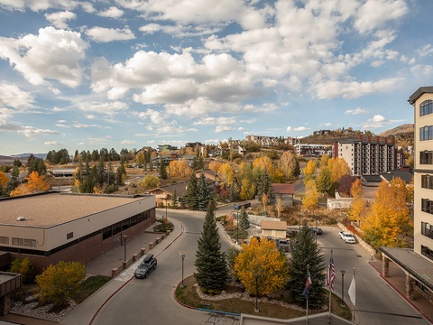 Scenic autumn neighborhood view showing vibrant fall foliage and surrounding mountain community near the property entrance.