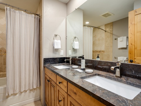 Refresh in your private bathroom with dual sinks, elegant granite counters, and a relaxing tub-shower combo—all thoughtfully designed for your comfort.