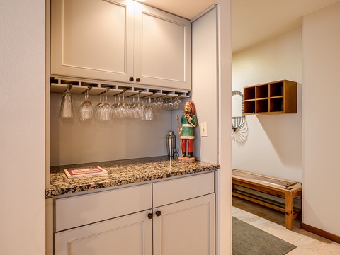 Your own stylish wet bar awaits, complete with granite counters, wine glass storage, and a cocktail shaker ready for après-ski celebrations or quiet evenings in.