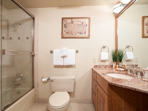 Your private bathroom features a granite vanity, fresh towels, and a shower-tub combo—everything you need to unwind after exploring.