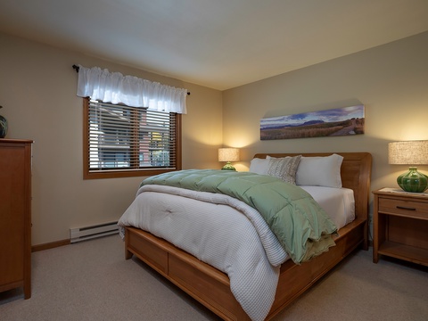 Sink into plush bedding and wake to peaceful mountain views. Your cozy retreat features warm wood furnishings and thoughtful touches to help you unwind completely.
