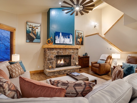 Sink into plush seating by your crackling fireplace and unwind after a day of adventure. Vaulted ceilings and warm mountain decor invite you to relax in cozy comfort.