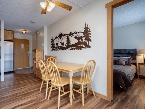 Step into your cozy mountain retreat where rustic charm meets modern comfort. Gather around the handcrafted dining table beneath gentle ceiling fan breezes, enjoying meals with loved ones surrounded by natural wood tones and wildlife-inspired décor.