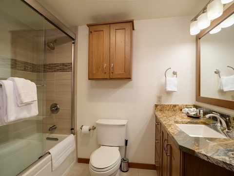 Your private bathroom features a granite vanity, full tub-shower combo, and soft towels—everything you need to refresh after a day of adventure.