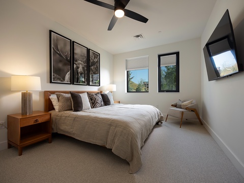 Sink into the plush king-sized bed and unwind in your serene bedroom retreat, where soft linens, modern furnishings, and peaceful natural light create the perfect space for your most restful sleep.