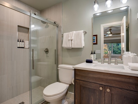 Step into your private retreat with a sleek glass shower, plush towels, and a bright, modern vanity that makes your morning routine feel effortless and serene.