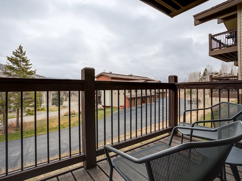 Step onto your private balcony and breathe in the crisp mountain air while taking in serene views of the surrounding neighborhood and distant hills.