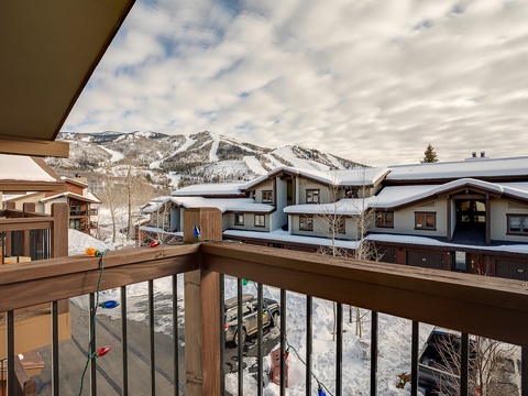 Snow-capped peaks frame this alpine village with ski-in accessibility, neighboring lodges blanketed in fresh powder, and mountain trails cutting through pristine winter terrain—an ideal base for slope-side living.