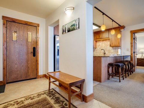 Step into your inviting mountain retreat, where warm wood tones and modern conveniences blend seamlessly. Your fully-equipped kitchen awaits, complete with granite counters and cozy breakfast bar seating.