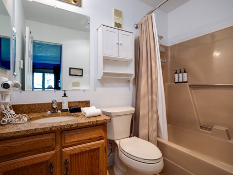 Your clean, well-equipped bathroom offers everything you need for a comfortable stay, with a full tub-shower combo and thoughtful touches like fresh towels and amenities.