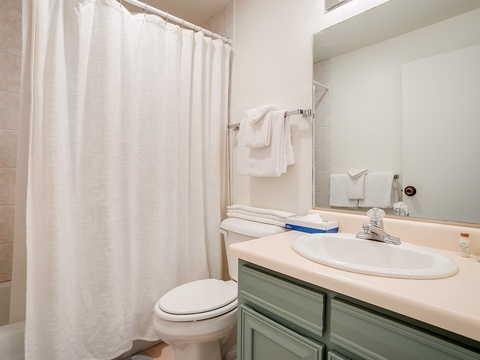 Your private bathroom awaits with a clean, crisp shower, fresh towels, and everything you need to refresh and recharge during your stay.