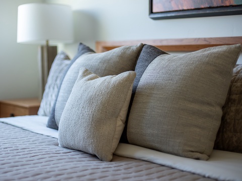 Sink into plush pillows and crisp linens after a day of adventure. Your peaceful retreat awaits with soft textures and calming tones to help you unwind.