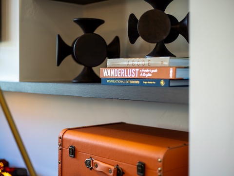 Thoughtfully styled shelving adds personality and charm to your stay, with curated books and decor that invite you to settle in and feel at home.