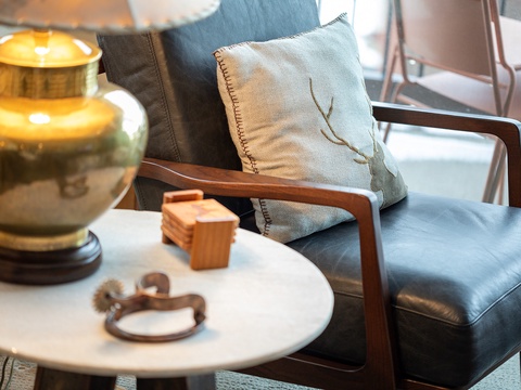 Sink into this sleek leather chair with your favorite book or morning coffee. The warm lamp and thoughtful details create the perfect corner for unwinding after your adventures.