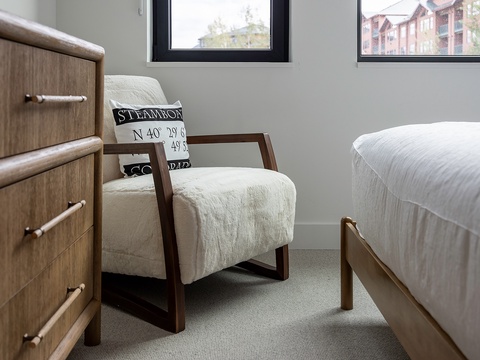 Settle into the cozy reading nook by the windows, where natural light streams in and you can glimpse the neighborhood just outside your private retreat.