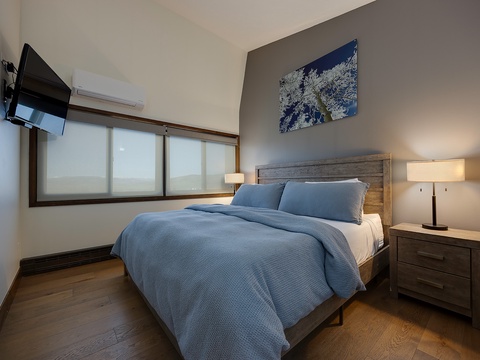 Sink into this plush bed after your adventures, with soft lighting, mountain art, and your own AC to set the perfect sleeping temperature.