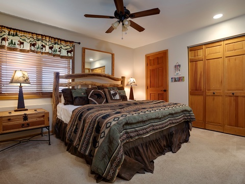 Your mountain retreat awaits with rustic log bed, cozy lighting, and a ceiling fan to keep you comfortable. Ample closet space and peaceful decor help you unwind.