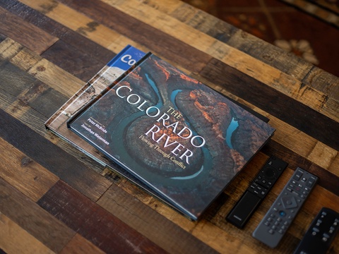 Perfect for planning your next adventure—coffee table books and entertainment remotes wait for you to unwind and explore the area's stunning scenery.