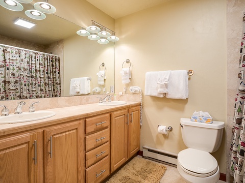 Freshen up in your well-appointed bathroom with a double-sink vanity, plush towels, and modern fixtures that make mornings easy.