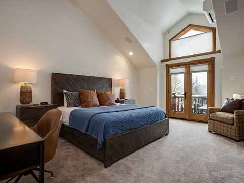 Wake up to snowy treetops framed by the door to your private balcony. This spacious retreat features vaulted ceilings, a cozy reading chair, and a plush king bed calling your name.