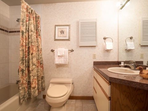 Your private bathroom features a fresh, clean design with a tub-shower combo, elegant vanity, and all the essentials for a comfortable stay.